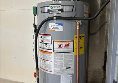 A room equipped with a water heater, furnace, and other machinery, showcasing a functional utility space.